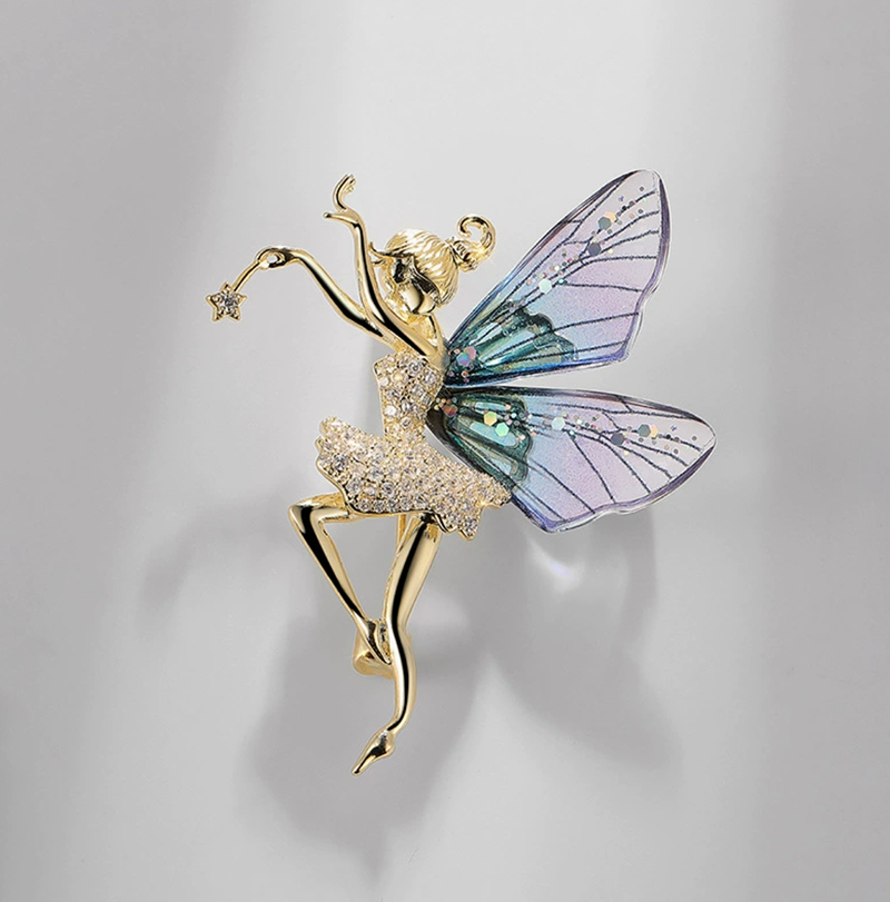 Elegant nature-inspired brooch featuring a fairy design with sparkling details and colorful wings