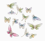 Collection of elegant nature-inspired brooch featuring colorful insect designs and intricate detailing
