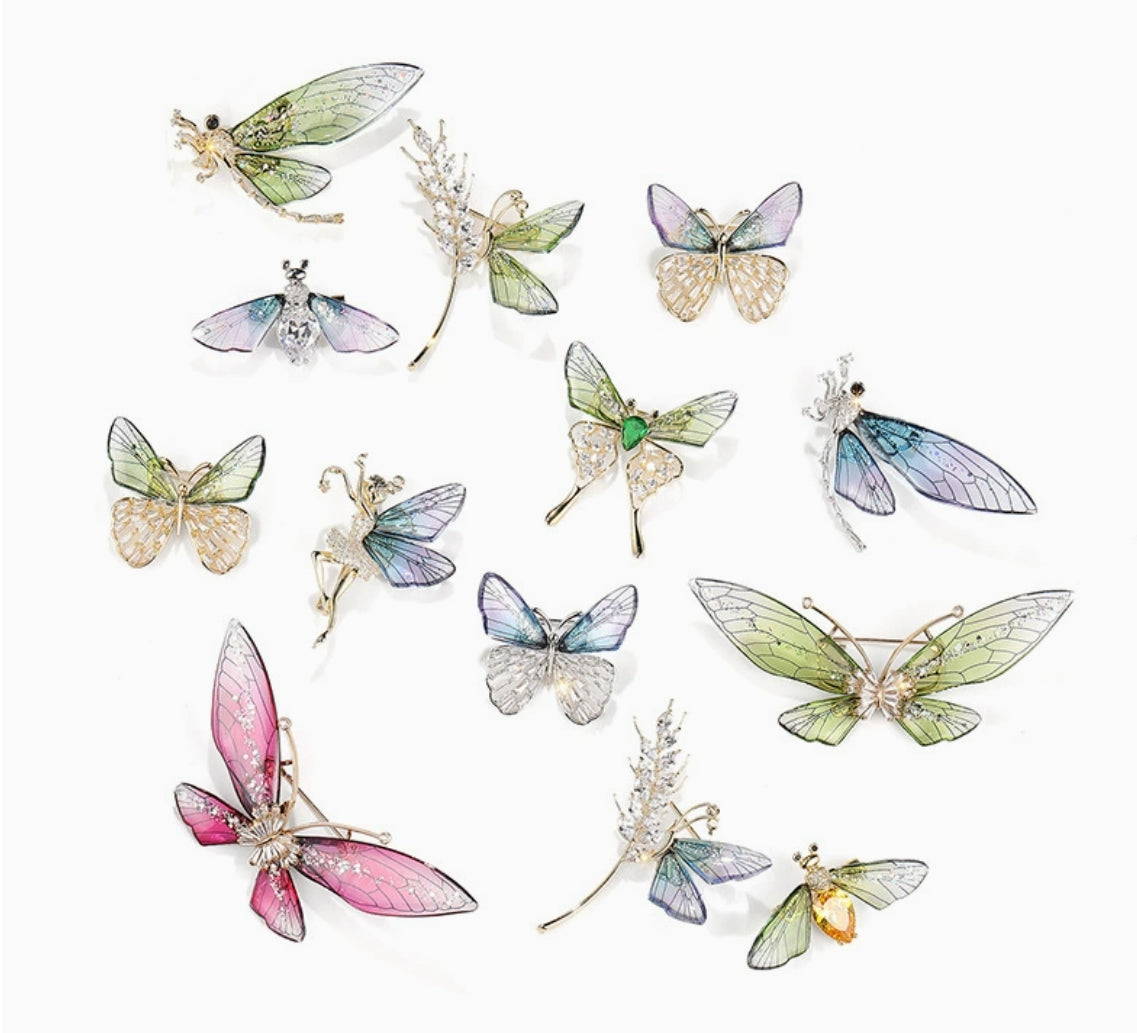 Collection of elegant nature-inspired brooch featuring colorful insect designs and intricate detailing