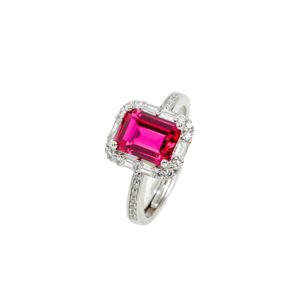 Origsoul emerald cut-engagement ring with vibrant pink gemstone and diamond halo on silver band