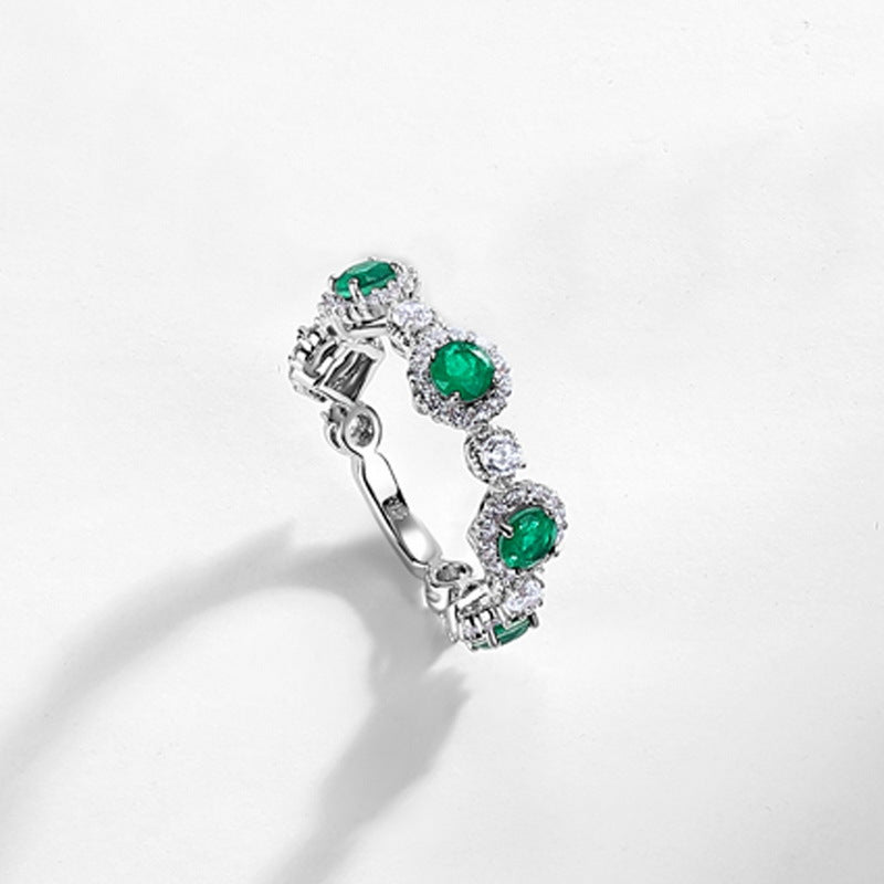 Origsoul engagement ring emerald cut with vibrant green emeralds and sparkling diamonds in silver band