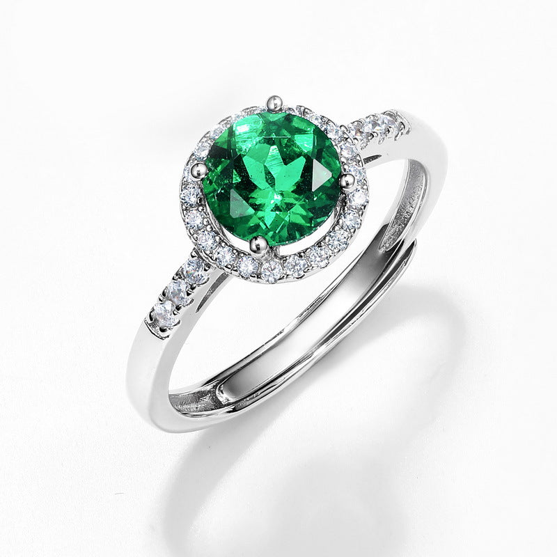 Origsoul emerald cut wedding ring with vibrant green center stone and diamond halo on silver band