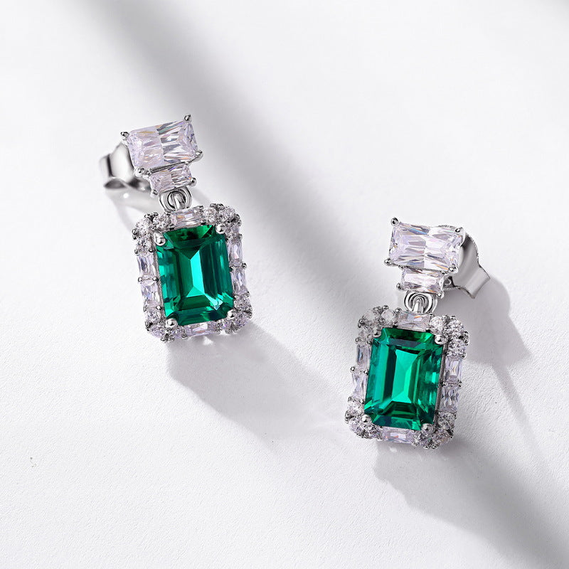 Origsoul earrings with pearl drop featuring emerald green stones surrounded by clear crystals
