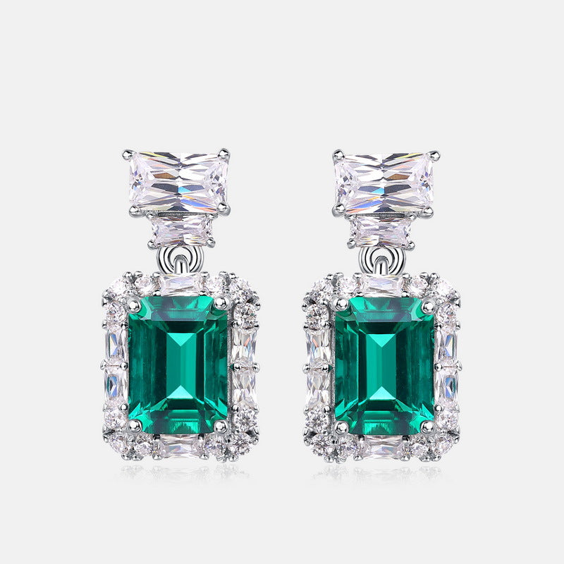Origsoul earrings with pearl drop featuring emerald green and clear gemstones in silver setting