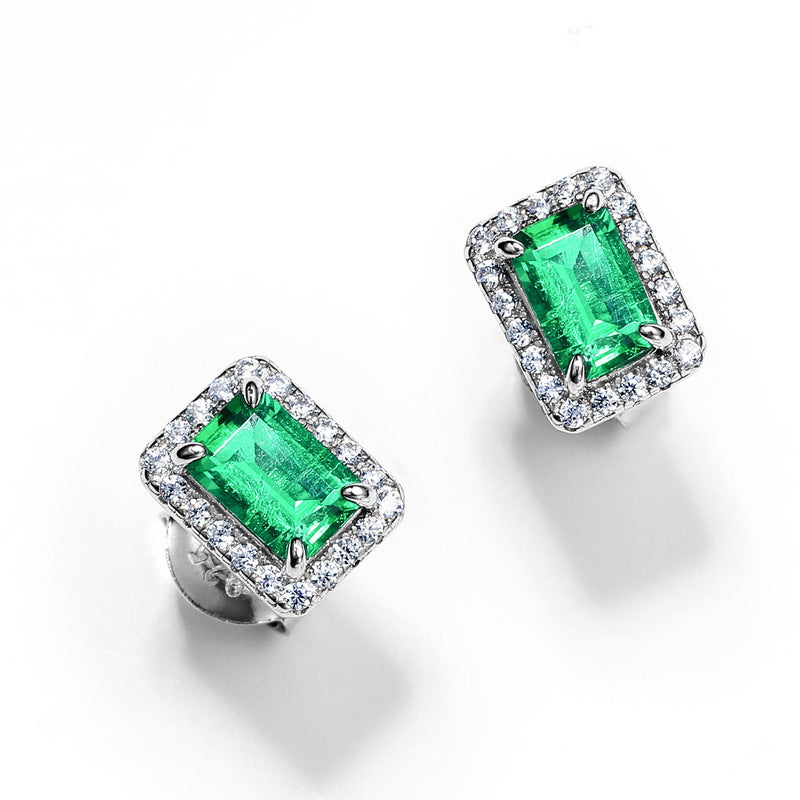 Origsoul ear stud earrings with rectangular green gemstones surrounded by sparkling clear stones