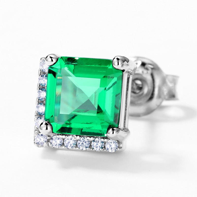 Origsoul emerald earrings with square green gemstone and surrounding clear stones in silver setting
