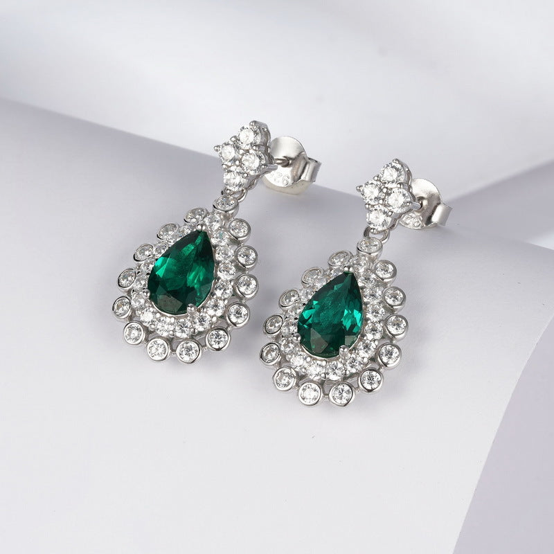 Origsoul emerald earrings earrings with teardrop green stones surrounded by clear crystals in silver setting