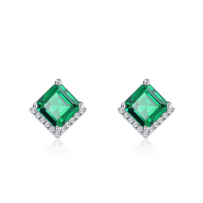 Origsoul emerald earrings with square green gemstones and diamond accents in silver setting