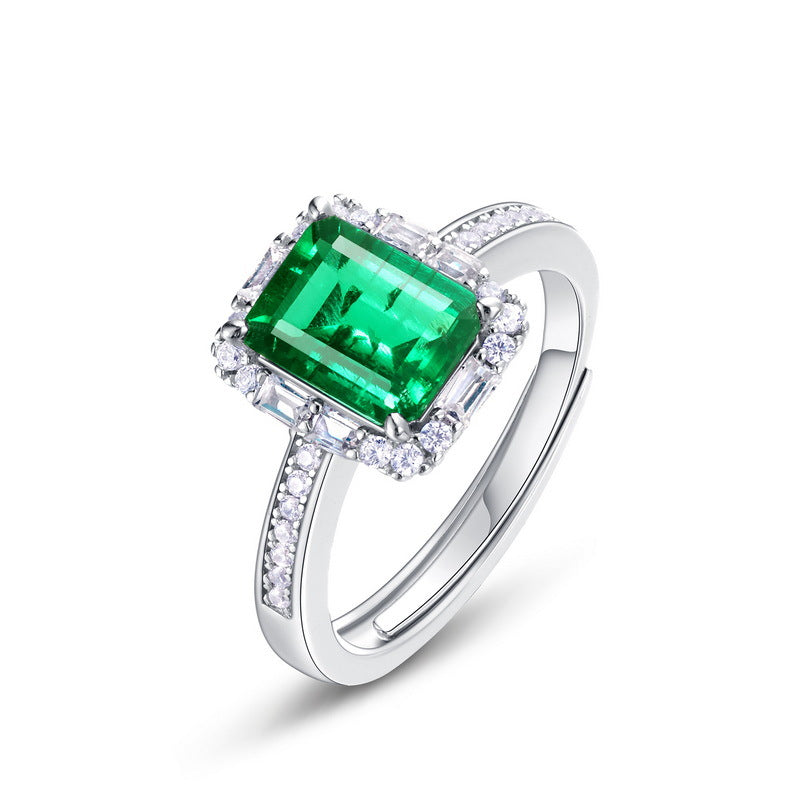 Origsoul silver ring with large rectangular green emerald and small white stones on band