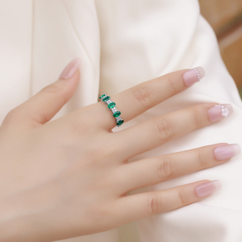 Origsoul emerald engagement ring cut band with alternating rectangular emeralds on finger