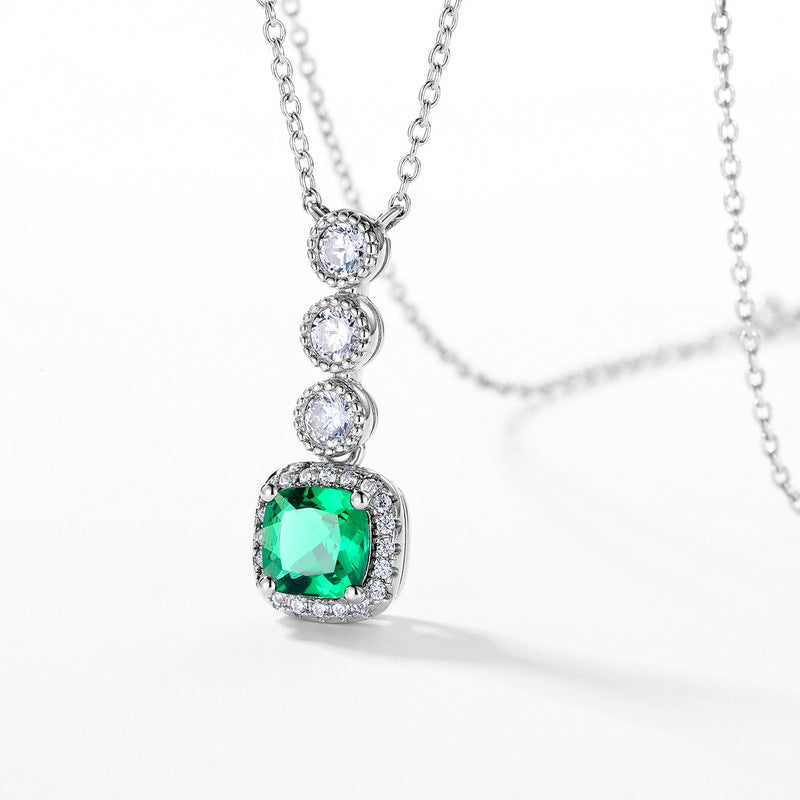 Origsoul silver necklace emerald pendant with three round white stones above a square emerald gemstone