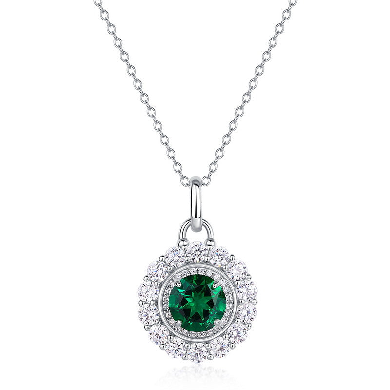 Origsoul emerald necklace with round green gemstone surrounded by clear crystals on silver chain