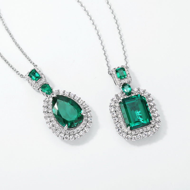 Origsoul emerald necklace set featuring pear and rectangular shaped green gemstones with surrounding diamonds