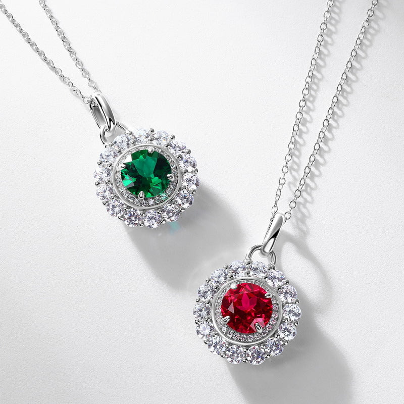Origsoul emerald necklace with green gemstone surrounded by clear crystals on silver chain