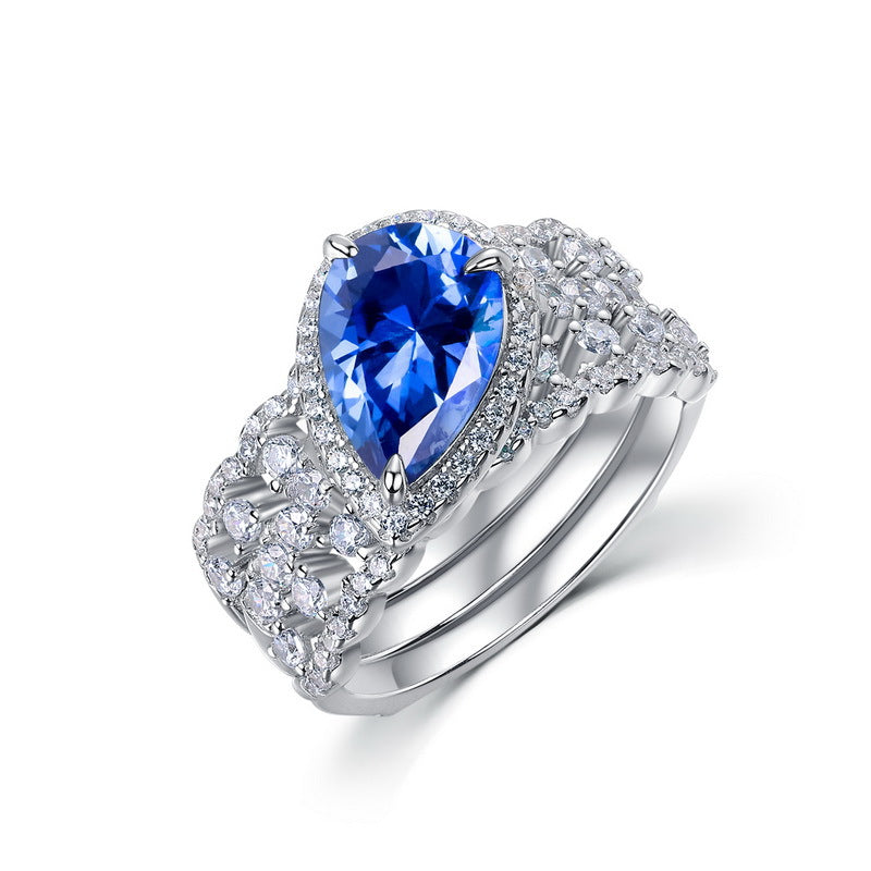 Origsoul pear shaped blue gemstone engagement ring emerald cut with diamond accents on silver band