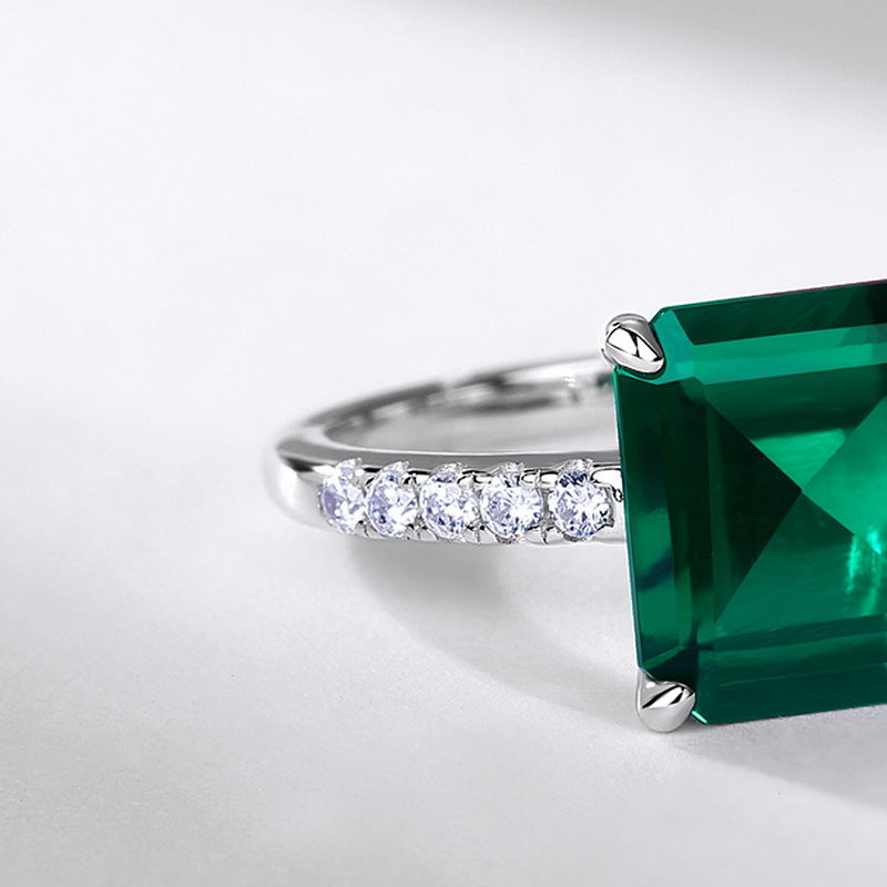 Origsoul engagement ring emerald cut with vibrant green stone and diamond accents on silver band