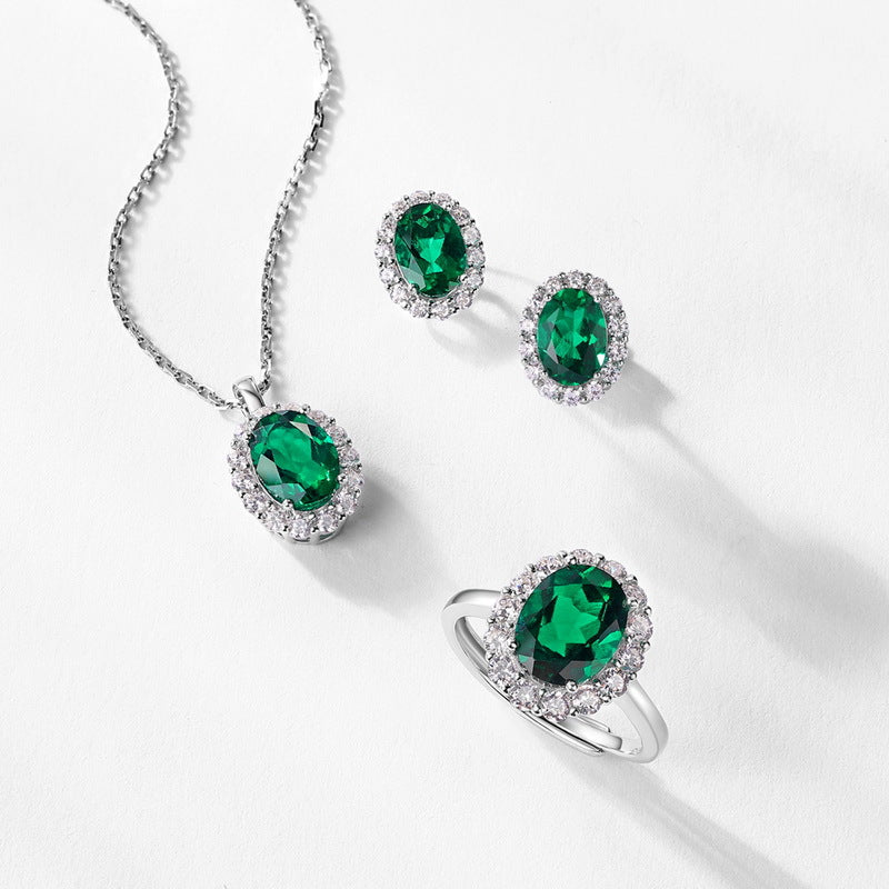Origsoul jewelry set with engagement ring emerald cut green gemstones surrounded by small diamonds