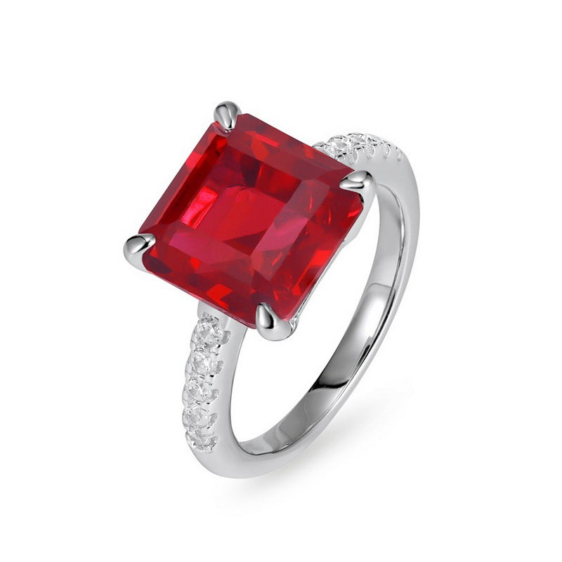 Origsoul engagement ring emerald cut with large red gemstone and diamond accents on silver band