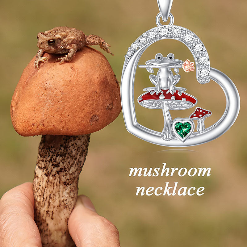 Origsoul frog mushroom necklace silver pendant featuring frog on red mushroom inside heart shape with green gem