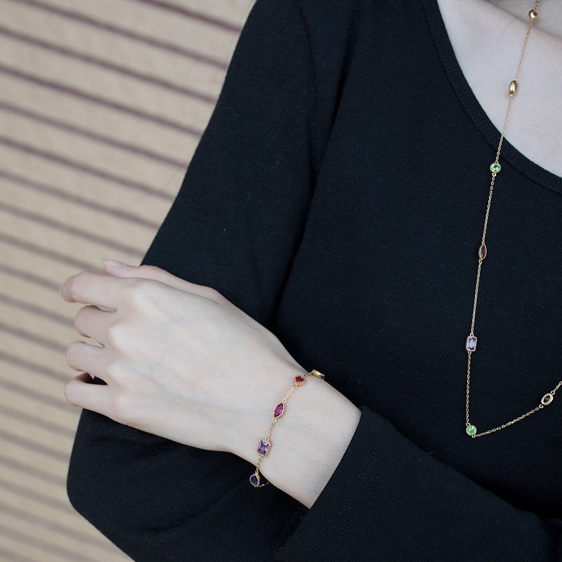 Origsoul bracelet sterling silver with multicolor gemstones worn on wrist with black long sleeve