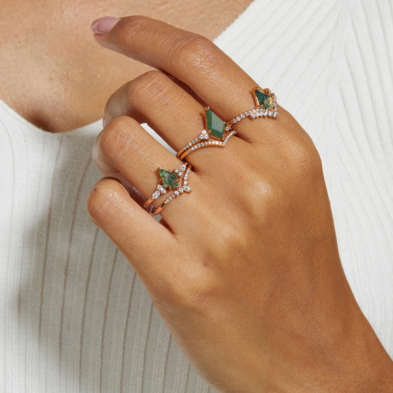 Origsoul moss agate ring set with green stones and small crystals on woman’s hand