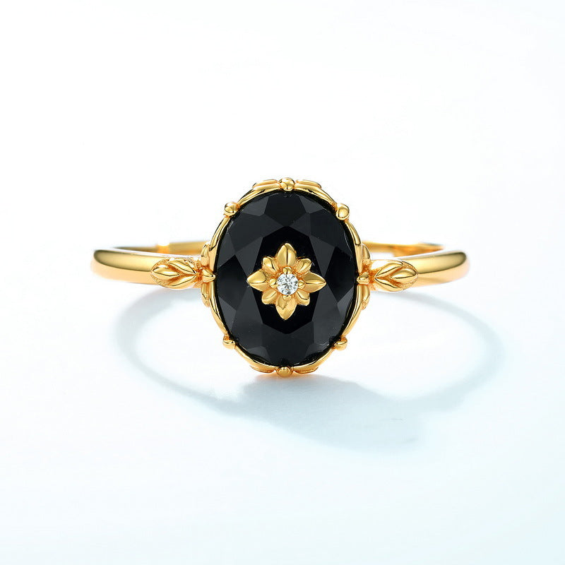 Origsoul silver sterling ring with gold floral design and black oval gemstone centerpiece