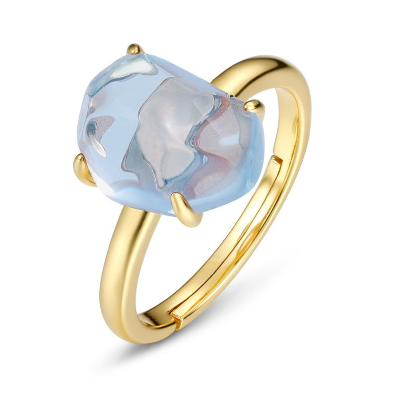 Origsoul ring sterling silver with gold finish featuring a large blue irregular-shaped gemstone
