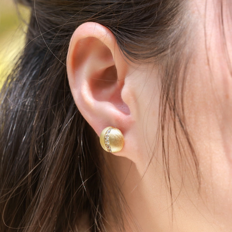 Origsoul gold tone silver sterling silver earrings with embedded stones on ear