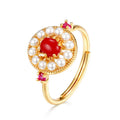 Origsoul unique gemstone jewelry ring with a red center stone surrounded by pearls on a gold band