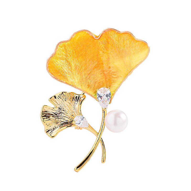 Origsoul brooch featuring a gold and orange ginkgo leaf tree design with pearl and crystal accents