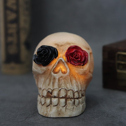 Origsoul Halloween skull light decor with red and black rose eyes glowing on grey surface