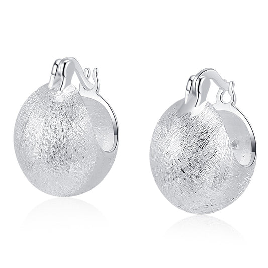 Origsoul hand-drawn silver earrings with textured finish and rounded hoop design