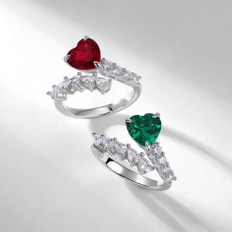 Origsoul emerald cut-engagement ring featuring heart-shaped green gemstone with side diamonds on silver band