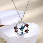Origsoul hummingbird floral necklace with blue hummingbird pendant and red flowers on silver chain