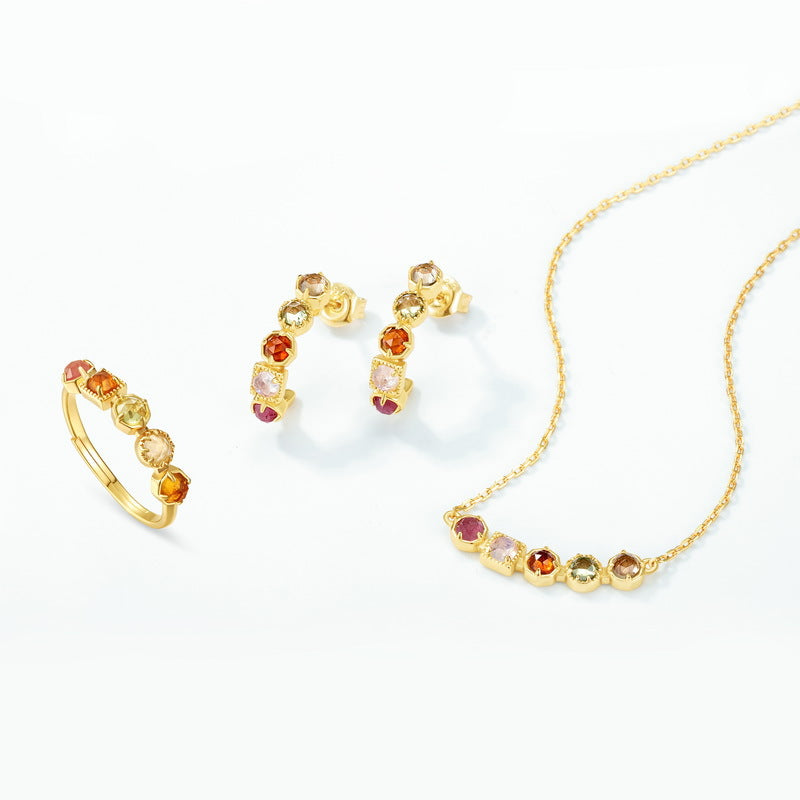 Origsoul sterling silver jewerly set with gold plating and colorful gemstone accents including ring, earrings, and necklace