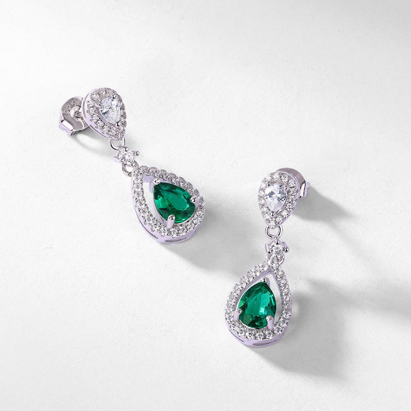 Origsoul elegant earrings with emerald teardrop stones surrounded by sparkling clear crystals