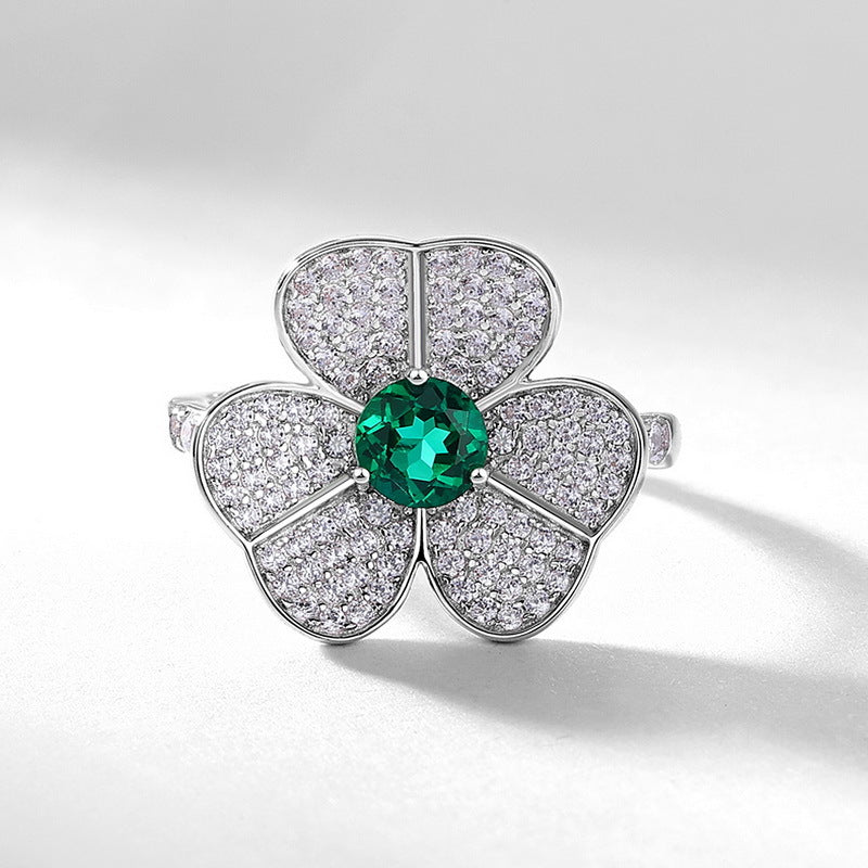 Origsoul floral design ring featuring an emerald cut-engagement ring style center green gemstone