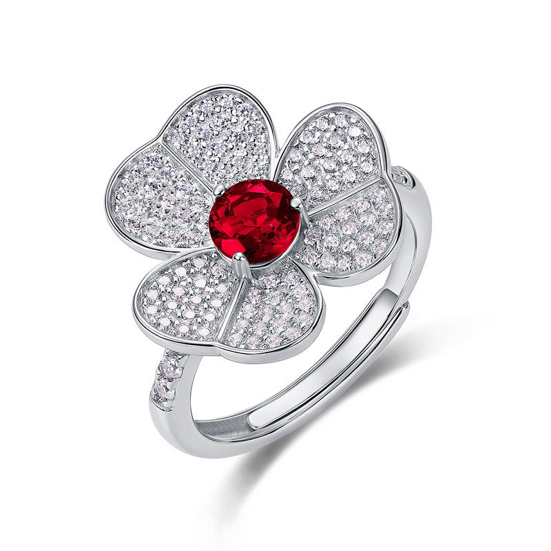 Origsoul flower-shaped ring with red center and diamond accents, not an emerald cut-engagement ring
