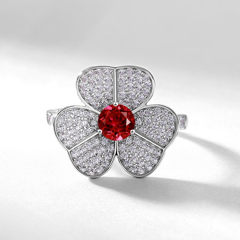 Origsoul flower-shaped ring with red center stone and sparkling petals with diamonds, emerald cut-engagement ring