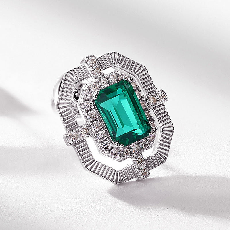 Origsoul hypoallergenic stud earrings with emerald green center stone and silver detailed setting