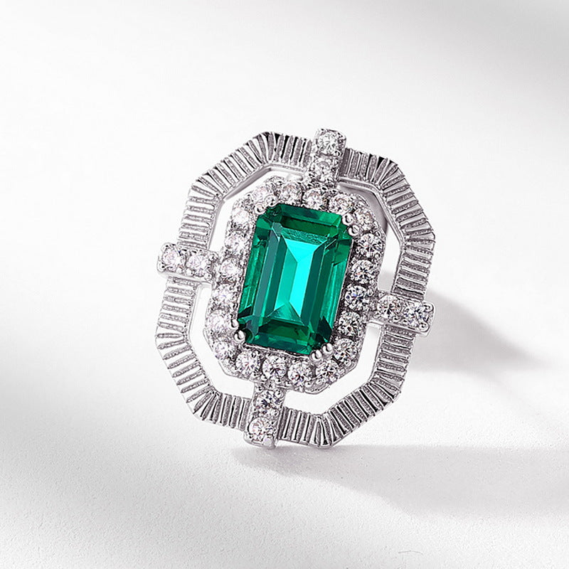 Origsoul hypoallergenic stud earrings with emerald-cut green gemstone and intricate silver detailing