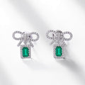 Origsoul silver sterling silver earrings with bow design and emerald green rectangular stones