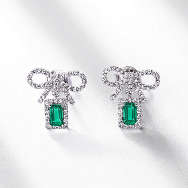 Origsoul silver sterling silver earrings with bow design and emerald green rectangular stones