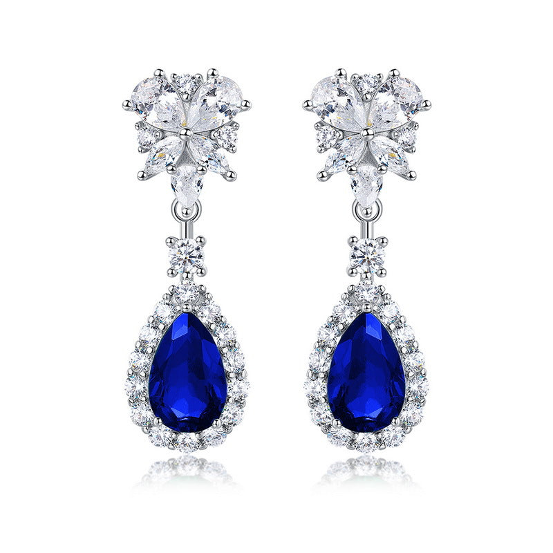 Origsoul sterling silver earrings with blue teardrop gemstones and clear crystal accents