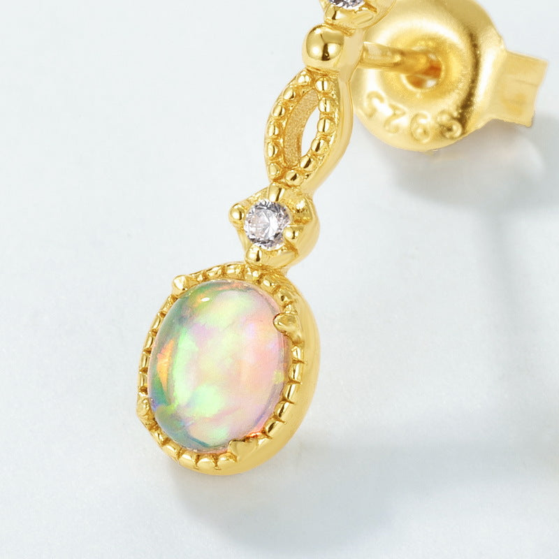 Origsoul sterling silver hoop earrings with gold plating and iridescent opal gemstone detail