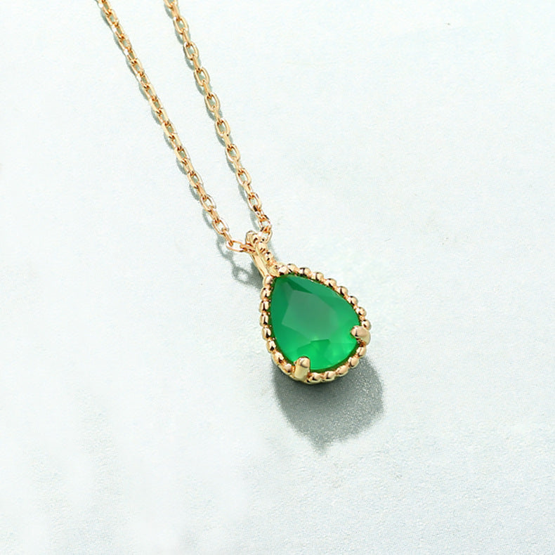 Origsoul green gemstone pendant necklace in gold setting, does not show men's silver cross pendant