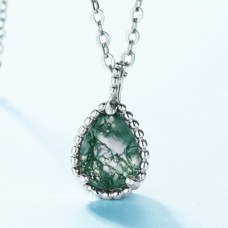 Origsoul men's silver cross pendant necklace featuring a green teardrop stone with intricate silver detailing