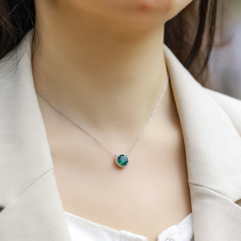 Origsoul delicate silver necklace and choker with a green gemstone pendant on a woman