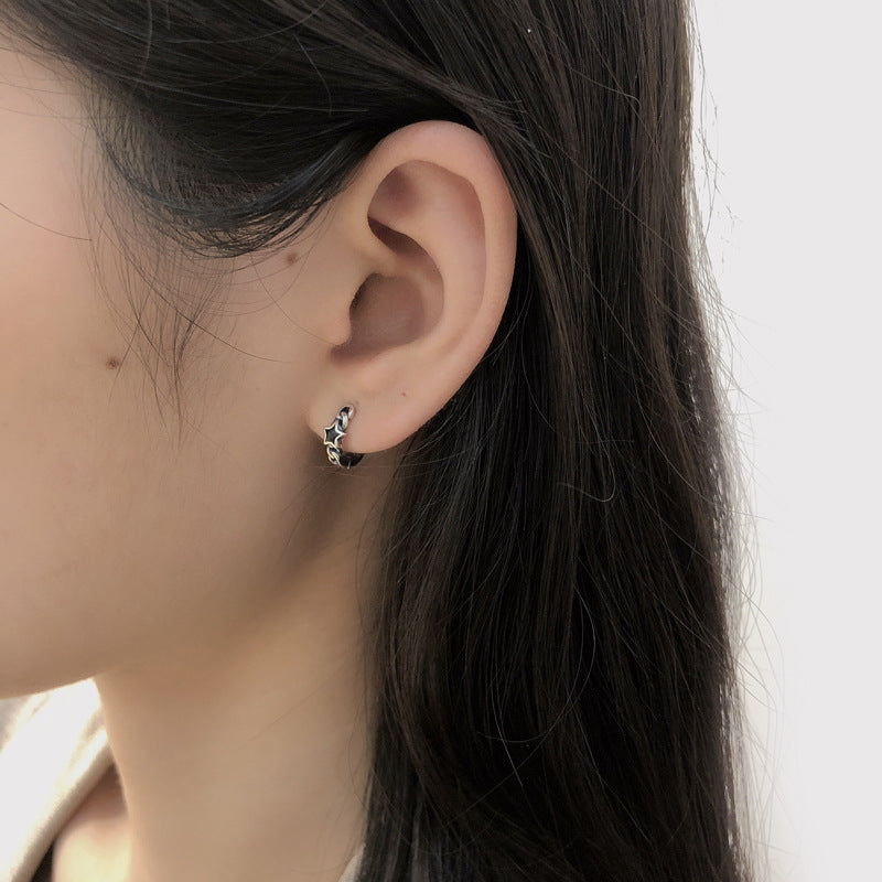 Origsoul cosmic jewelry twisted style earrings for women worn on ear with black hair