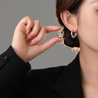 Origsoul modern bumpy hoop earrings worn on model in black outfit with close-up view